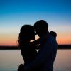 Silhouettes of a couple in love romance at sunset.