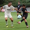 Der TSV Aindling in weiß, hier Mittelfeldspieler David Bichlmeier, musste sich im Totopokal dem FC Memmingen, hier Luis Vetter, geschlagen geben.