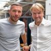 Der Ex-Fußballnationalspieler Lukas Podolski (l.) und der Musikmanager Markus Krampe haben das Glücksgefühle-Festival auf dem Hockenheimring organisiert. (Archivbild)