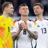 Die 2014-Weltmeister Manuel Neuer (l), Toni Kroos (M) und Thomas Müller (r) werden in München verabschiedet.