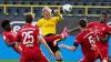Borussia Dortmund - FC Bayern München im Signal Iduna Park: Münchens Alphonso Davies, Thomas Müller, Benjamin Pavard, Jerome Boateng und Dortmunds Julian Brandt (M) kämpfen um den Ball. Die Pressestimmen zum Spiel.