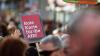 "Rote Karte für die AfD"" ist auf einem Plakat bei einer Demonstration gegen rechts in der Würzburger Innenstadt zu lesen.