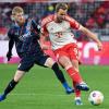 Jan-Niklas Beste (l) hat Bayern-Erfahrung. Mit Hoffenheim spielte er schon in München und gegen Harry Kane (r).