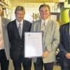 Jürgen Redlin von der IHK Würzburg-Schweinfurt (Zweiter von links) überreichte zum Betriebsjubiläum der LHS-Germany GmbH  die Ehrenurkunde der IHK an die drei Geschäftsführer Roland Ehwald, Friedhelm Landgraf und Horst Landgraf (von links).