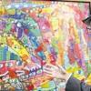 Los: James Rizzi vor einem seiner Werke.
