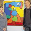 Die Initiatoren der Bier-Ausstellung: Stefanie Kuch-Steudemann und Peter Glückstein vor dem Bild des Franzosen Thierry Noir, der sich einen Namen mit seinen Bildern auf der Berliner Mauer machte.