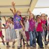 Kinder als Hauptdarsteller: In der sanierten Schule fühlen sie sich jetzt als „Supermann“.