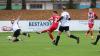 1:0 für den FC Haßfurt: Lukas Schönbach (21) zieht ab und trifft zur frühen Führung. Trossenfurts Kevin Steinmann (links) kann nichts ausrichten.