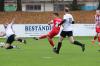 1:0 für den FC Haßfurt: Lukas Schönbach (21) zieht ab und trifft zur frühen Führung. Trossenfurts Kevin Steinmann (links) kann nichts ausrichten.