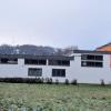 Seitenansicht von der Straße am Güßgraben auf den Gebäudekomplex von Team Orange, dessen Erdgeschoss nun als Notunterkunft dient. Seitenansicht von der Straße am Güßgraben auf den Gebäudekomplex von Team Orange, dessen Erdgeschoss nun als Notunterkunft dient.
