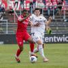 Fabrice Montcheu (11) von den Würzburger Kickers  im Laufduell mit Jim-Patrick Müller (10) vom DJK Vilzing.  Die Würzburger Kickers gewinnen das letzte Heimspiel am Samstag 18.05.24 gegen die DJK Vilzing souverän mit 4:0 in der AKON Arena in Würzburg. Nach dem Spiel werden sie vom BFV zum Regionalliga Meister 2024 geehrt.