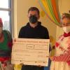 Schlawine, Geschäftsführer Fabian Ziegler von Burmester & Partnerund Flora (von links) bei der Spendenübergabe.