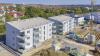 Neubauten an der Eselshöhe: Die Mehrfamilienhäuser Heinrich-Böll-Straße 21 und 27. Am rechten Bildrand: Die Baustelle für das Haus Heinrich-Böll-Straße 25.