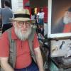 Der Maler Stevan an seinem Stand in Montmartre