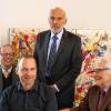 Jubilar Erich Rieger (stehend), und (von links) der frühere städtische Sozialreferent Peter Motsch, der Geschäftsführer des Aphasikerzentrums Unterfranken Thomas Hupp und Fördervereinsvorsitzender Dieter Gekle.