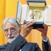 Hoch die Palme! Michael Haneke mit der Siegestrophäe.
