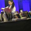Blättern in Bali-Büchern: Im Pavillon des Gastlandes Indonesien auf der Frankfurter Buchmesse findet sich auch ein in Bali-Roman aus Würzburg.Foto: FREDERIK VON ERICHSEN, DPA