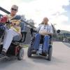 Auf Achse: Für Ingrid und Bruno Kamper gehört die Rollstuhlfahrt durch ihre Wahlheimat Lohr zum Tagesprogramm. Hier sind sie auf der neuen Mainbrücke unterwegs. FotoS: Ungemach
