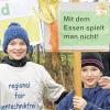 Demonstrieren gegen grünen Genmais.