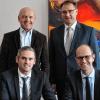 Landrat Thomas Habermann (hinten links) und der Chef der Agentur für Arbeit Schweinfurt, Thomas Stelzer (hinten rechts), Christian Koos (vorne links) neuer Chef Arbeitsagentur Bad Neustadt sowie Christian Kullick, neuer Leiter des Jobcenters.