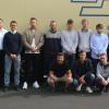 Im Bild: (hinten von links) Ausbildungsleiter Frank Göhring, Speditionsleiter Maximilian Beisheim, Justin Schmidt, Carsten Koch, Rodion Seitz, Simon Neuper, Florian Spath, Helena Grunert sowie (vorn) Mesut Velioglu, Andreas Schmitt und Dominik Brand. Foto: Nagel-Group, Kraftverkehr Nagel SE & Co. KG