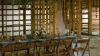 Laid Table By wedding banquet in a wooden barn. Wooden walls. Vintage Style.