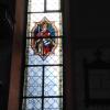 Bildnis des heiligen Kilian an der Nordseite der Kirchenfenster mit Glasschäden