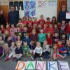 Andreas Scheb, Thomas Gerhard, Dirk Ohlhaut und Bernd Scheb bei der Spendenübergabe im Kindergarten Himmelstadt.