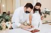 Wedding during the coronavirus epidemic. Bride and groom in protective medical masks. Marrieds and Covid-19 pandemic. Wedding during the coronavirus epidemic. Bride and groom in protective medical masks. Marrieds and Covid-19 pandemic.