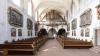 Das Kloster Schönau wurde zum Ende des 12. Jahrhunderts gegründet. Doch das barocke Ensemble geht auf die  Würzburger Kapuziner-Minoriten zurück, die 1699 das Kloster übernommen haben. Der Thüngersheimer Maler Georg Sebastian Urlaub schuf die bis heute erhaltene reiche Gemäldeausstattung in Kirche und Mönchchor. Die Bilder der Kreuzwegstationen wurden 2018 restauriert. 
