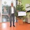 Scheckübergabe in den Wertheimer Werkstätten (von links): André Tschirnin, Vertreter des Werkstattrates der Wertheimer Werkstätten, Betriebsstättenleiter Klaus Drews und Filialdirektor Stefan Stumpf.