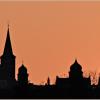 Die "Skyline" von Gerolzhofen, beim Sonnenaufgang fotografiert von Waldemar Wiederer. Das bisher gebräuchliche Logo der Stadt lehnte sich an diese mittelalterliche Stadtsilhouette an.