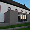 Farblich passend zur Gestaltung der Sitzstufen am Rathausplatz wurde der Anbau an die Alte Kirche gestrichen. Das gefällt nicht jedem in Waldbüttelbrunn.