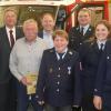 Ehrungen bei der Hoheimer Feuerwehr (von links): Kreisbrandmeister Steffen Gernert, stellvertretender Landrat Robert Finster, Burkhard Scheuring, Oberbürgermeister Stefan Güntner, Daniela Holzleitner, Kommandant Michael Kruggel, Vorsitzende Larissa Scherer und Harald Heckelmann.
