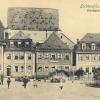 Blick vom Marktplatz auf den Kastenboden um 1910: Auf dem Dach steht abgekürzt der Name des Eigentümers, der „AG für Korbwaren- und Kinderwagen-Industrie vormals Hourdeaux-Bergmann“, wie das Unternehmen ab 1908 hieß. Blick vom Marktplatz auf den Kastenboden um 1910: Auf dem Dach steht abgekürzt der Name des Eigentümers, der „AG für Korbwaren- und Kinderwagen-Industrie vormals Hourdeaux-Bergmann“, wie das Unternehmen ab 1908 hieß.