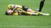 Dortmunds Marco Reus liegt verletzt am Boden.