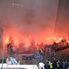 Fans im Fanblock des Karlsruher SC brennen Pyrotechnik vor Beginn der zweiten Halbzeit ab.