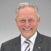 Wolfgang Grenke lächelt bei einem Interview.