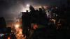 Palästinenser fliehen und tragen ihre Habseligkeiten entlang der Küstenstraße in Richtung des südlichen Gazastreifens.