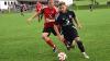 Sein Tor besiegelte die 1:3-Niederlage der DJK Schlimpfhof: Volkers' Daniel Kuznetzow (vorne), der hier das Leder gegen Maximilian Kleinhenz behauptet.